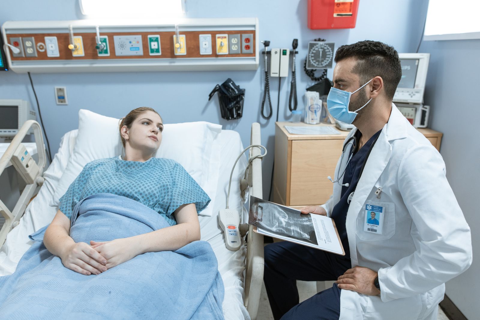 A physician and patient in conversation in a bright consulting room