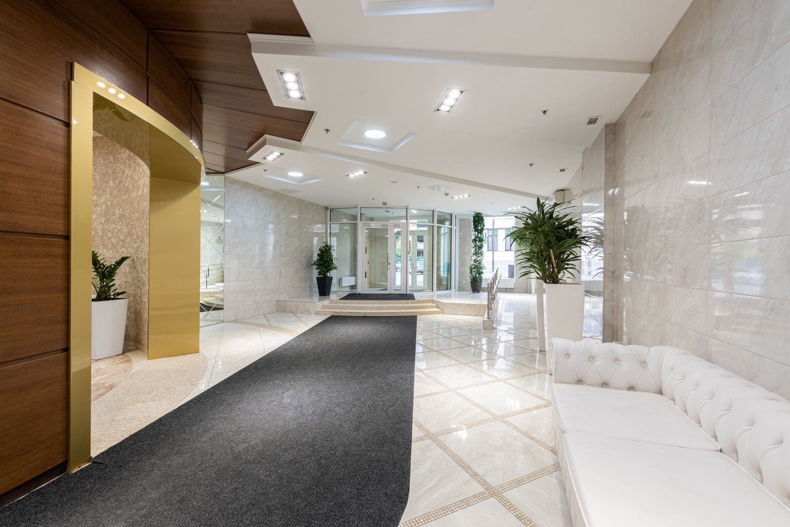 The calm, plant-filled reception lounge at the Brighton Way clinic